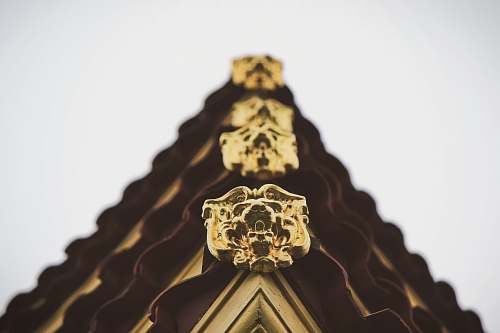 reading selective focus photography of roof corner